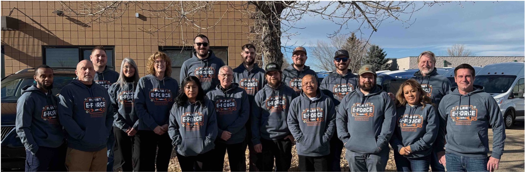 The Fleet EForce team together outside the facility
